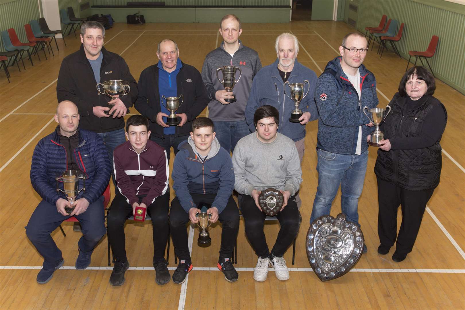 With the Caithness Small Bore Rifle Association indoor season drawing to a close, league and team trophies were presented in Watten hall following the St Clair Cup competition. Association secretary Marty Simpson is pictured presenting the county championship trophy to David Simpson of Wick Old Stagers. Looking on are some of the other shooters who accepted trophies on behalf of their clubs and teams. They are (from left, back) Don Mowat, Pentland, Graham Robertson, Stirkoke, John Harrold, Keiss, Brian Young, Wick Old Stagers; (front) John Campbell, Ross Sutherland, Robbie Levack, all Halkirk, and Ally Baikie, Westfield. Picture: Robert MacDonald / Northern Studios
