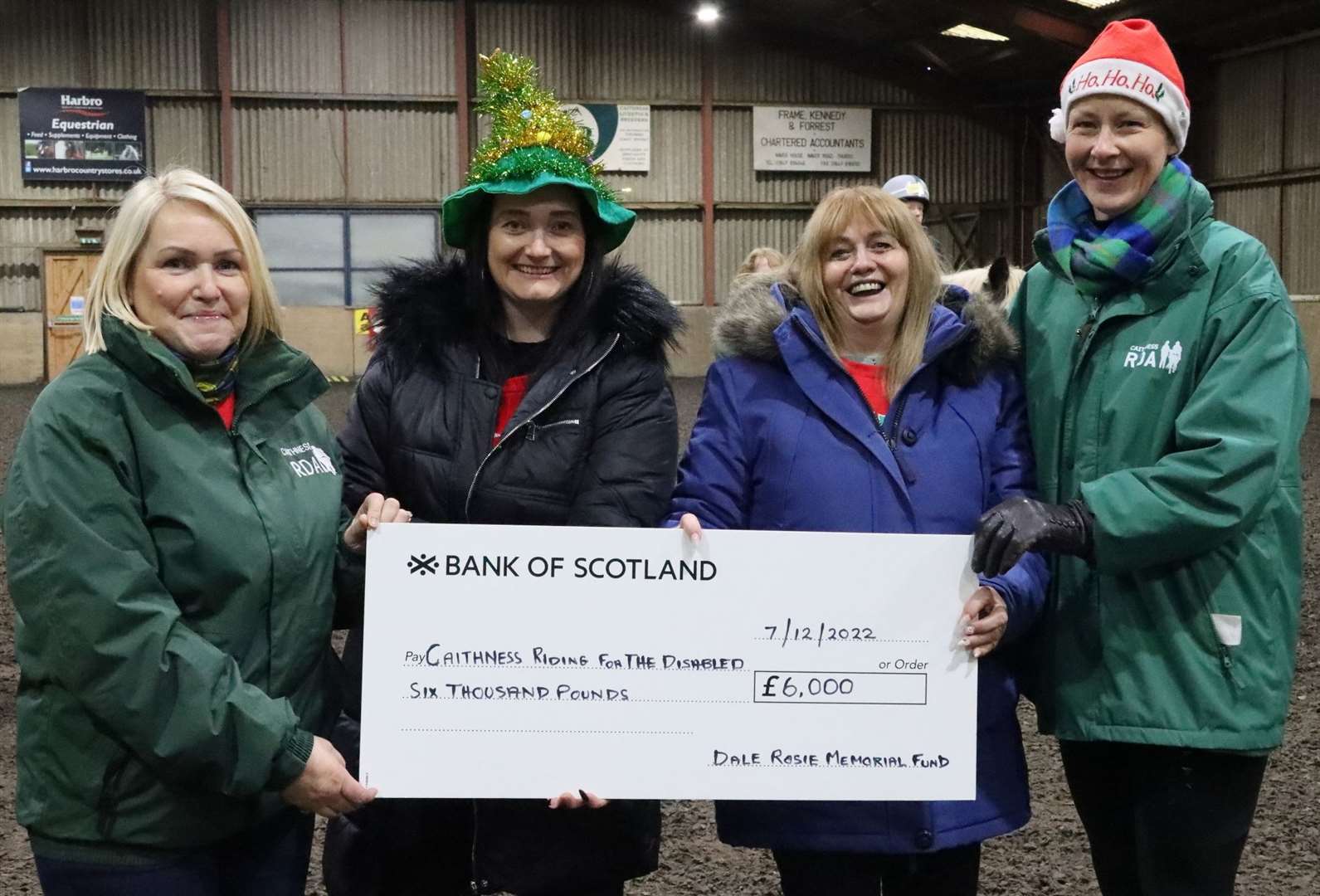 Caithness RDA chairperson Judith Miller (left) and secretary Liz Hewitson (right) accepting the cheque from Heather Rosie (second right) and her daughter Claire Fraser. Picture: Neil Buchan