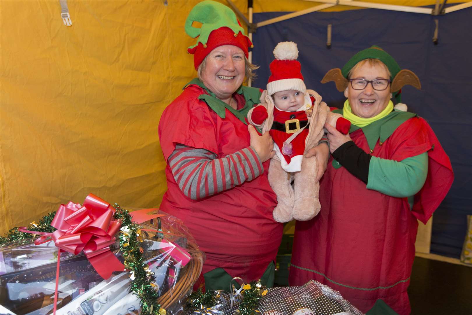 On the Friends of the North Baths stall, Patty Coghill (right) and Donna Plowman with a very young helper – Donna's great-niece, three-month-old Taylor Manson. Picture: Robert MacDonald / Northern Studios