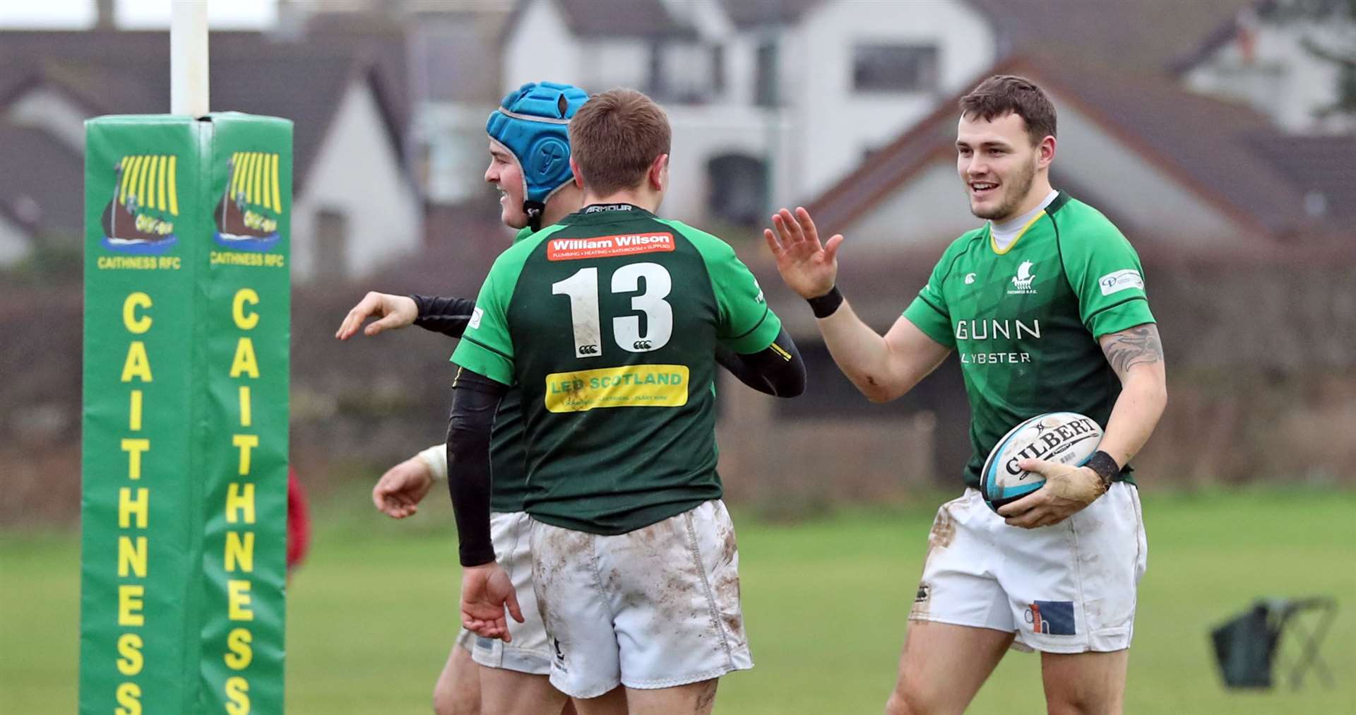 Caithness number 13 Douglas Webster congratulates Marc Anderson on scoring his try. Picture: James Gunn