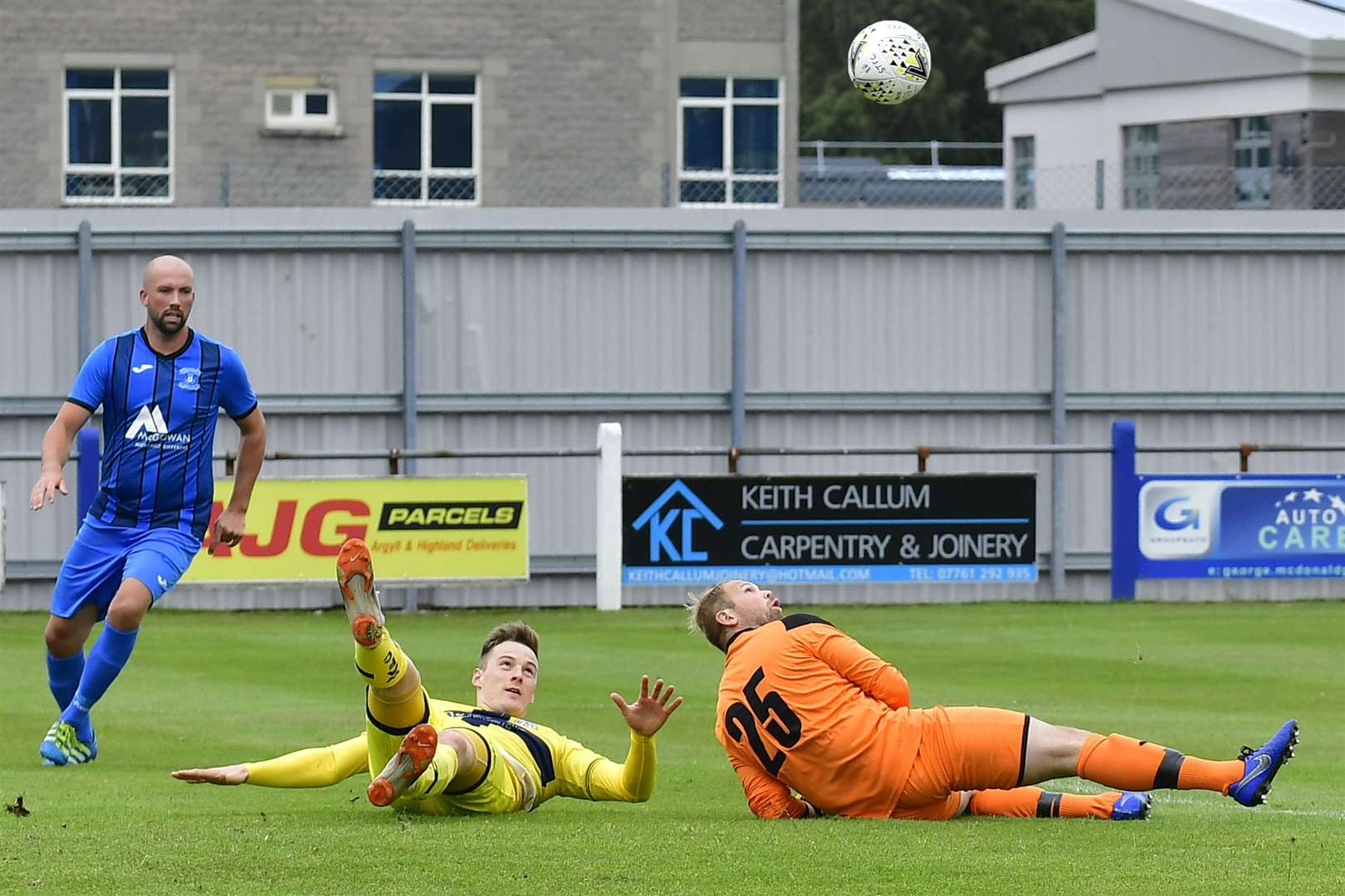 Wick Academy's Steven Anderson and Strathspey Thistle goalie Robert Donaldson keep their eyes on the ball. Picture: Mel Roger