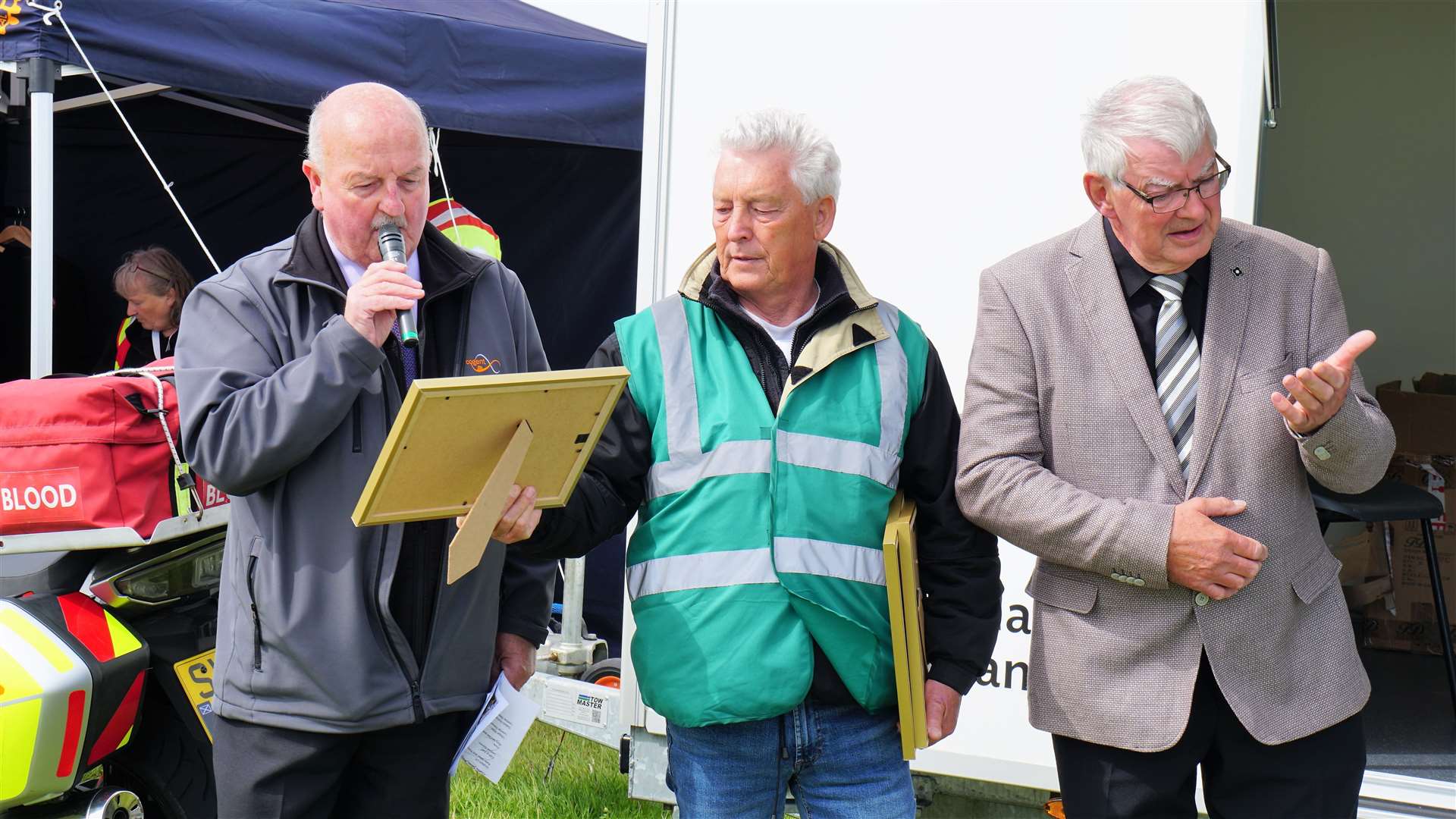 Willie Mackay, at left, compered the event and club members Les Bremner and Iain Sutherland stand next to him as the awards are handed out. Picture: DGS