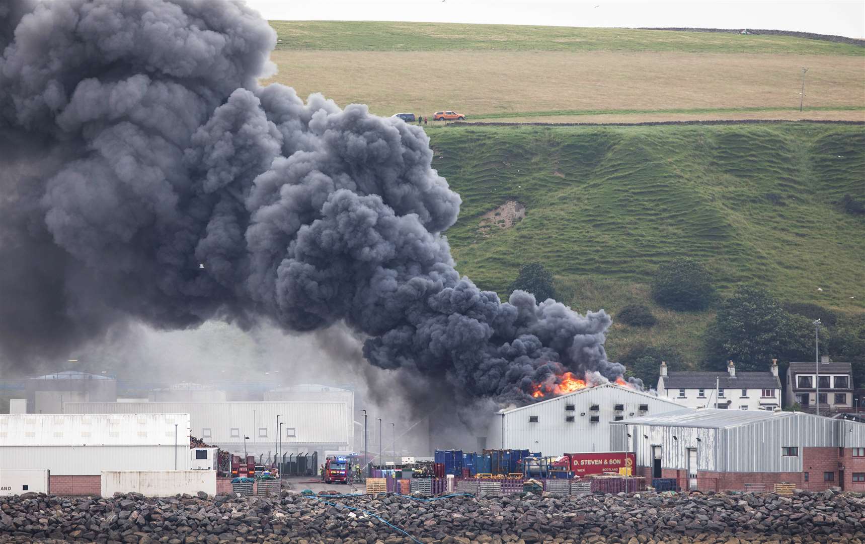 Thick black smoke billowing from Scrabster Seafoods on Sunday evening. Picture: Karen Munro