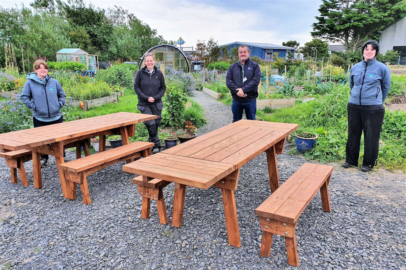 Taking receipt of the benches are (from left) Ann Brock, Jill Lawrie, community payback supervisor Bob Miller and Thurso Grows project co-ordinator Sharon Dismore,