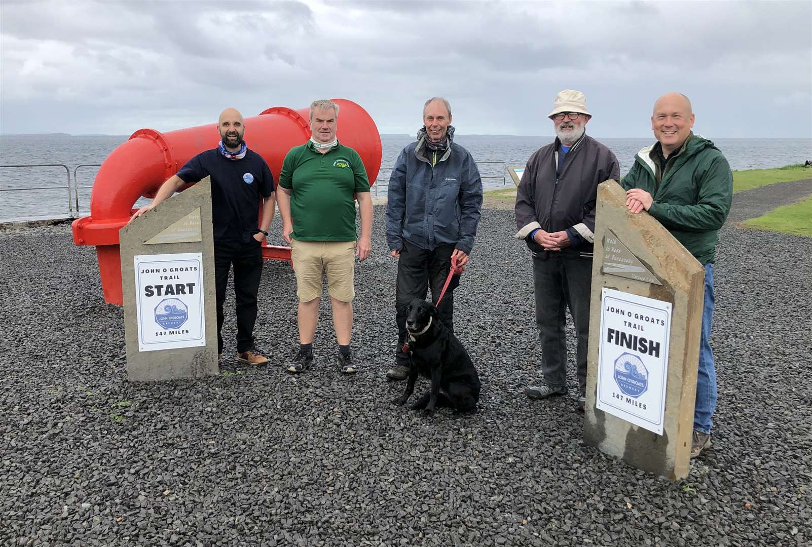 Two of the new trustees Simon Cottam (left) of John O’Groats Brewery, and Ian Ellis (second from the right) at the completed start and finish signs in John O'Groats last summer. Also present are other volunteers from the charity creating the John O’Groats Trail, as well as the North Coast Trail which extends to Cape Wrath – Derek Bremner, Charlie Bain and Jay Wilson.