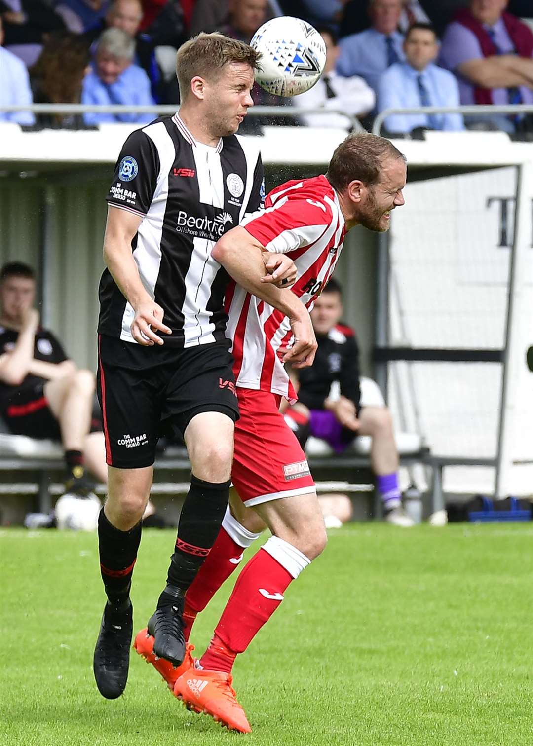 Wick's Alan Farquhar heads clear from Formartine's Garry Wood. Picture: Mel Roger