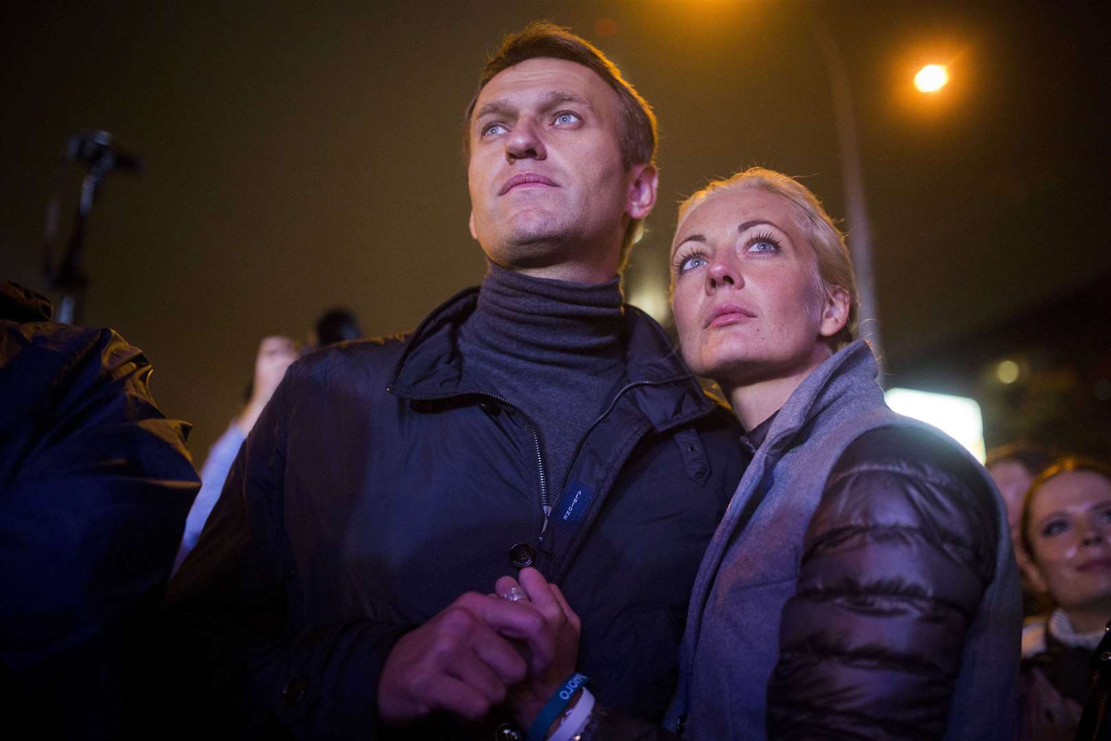 Alexei Navalny with his wife Yulia after a rally in Moscow in 2013 (Evgeny Feldman/AP)