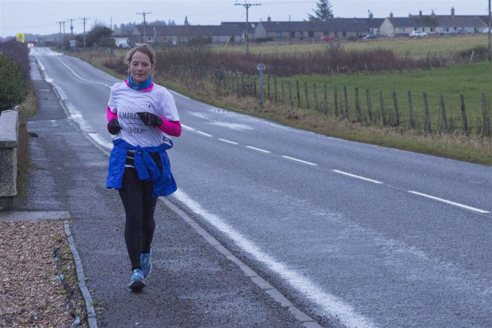 Past halfway to the finish of her 16th marathons in 16 days, Lorna Stanger passes through Bower on Sunday afternoon. Picture: Robert MacDonald/Northern Studios