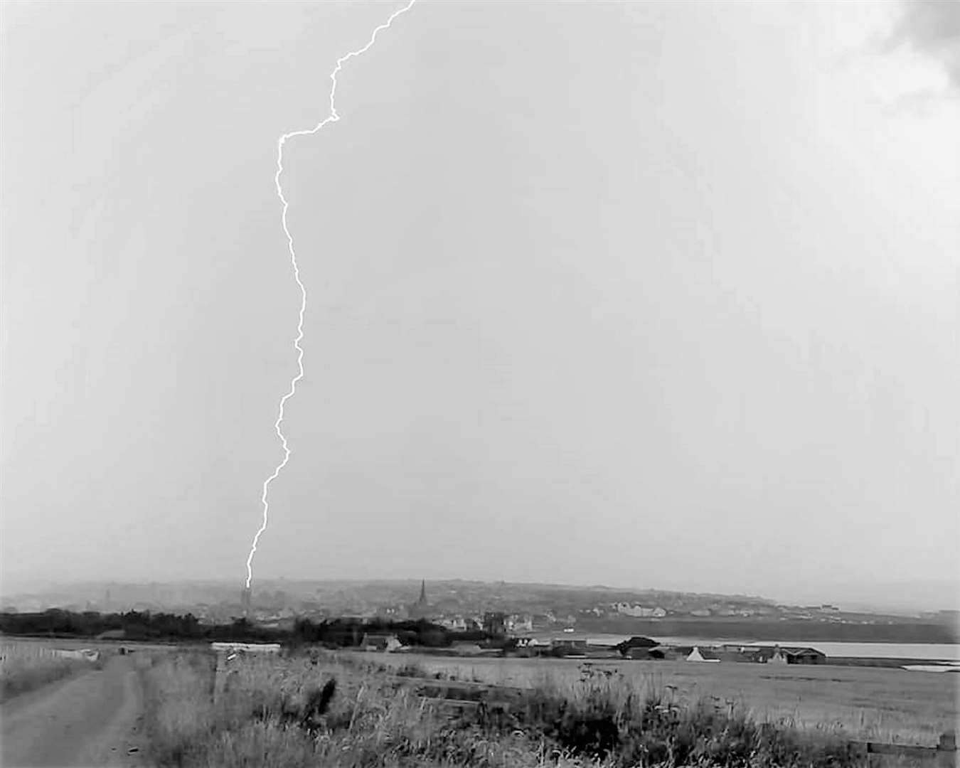 The moment lightning hit the church was captured in video footage. This frame grab from the footage clearly shows the strike on the tower. Picture: Ali Elder