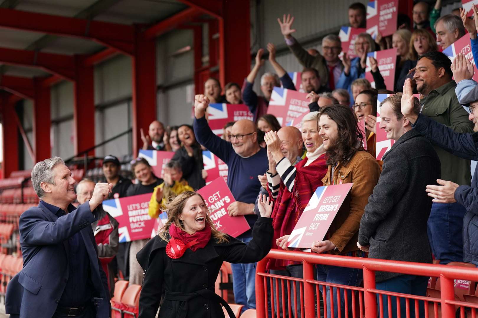 Sir Keir Starmer celebrates with newly elected MP Sarah Edwards at the ground of Tamworth FC (Jacob King/PA)