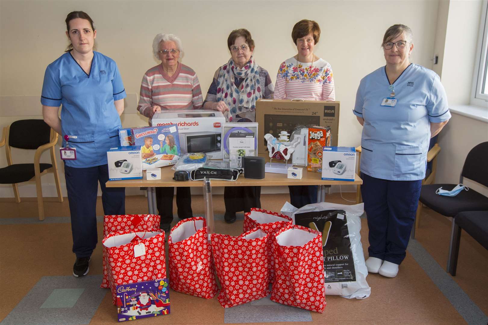 The League of Friends handing over gifts for the benefit of patients and staff in the various departments at Caithness General Hospital ahead of Christmas 2022. Picture: Robert MacDonald / Northern Studios