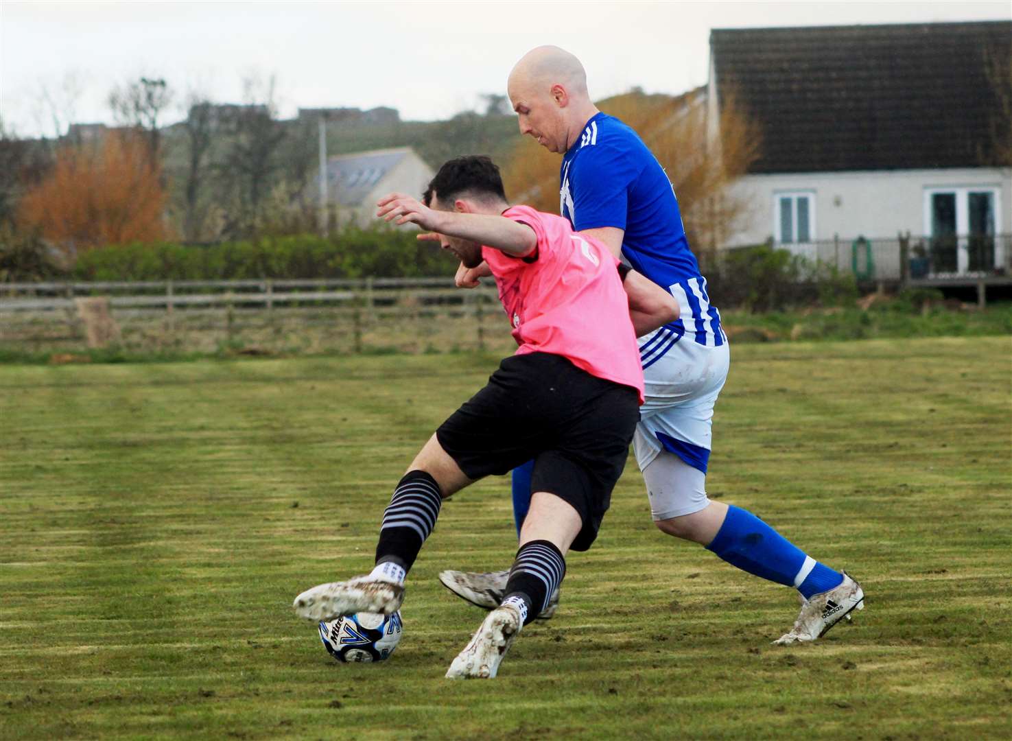 Lybster's Gary Weir (right) in action against Wick Thistle earlier in the season.
