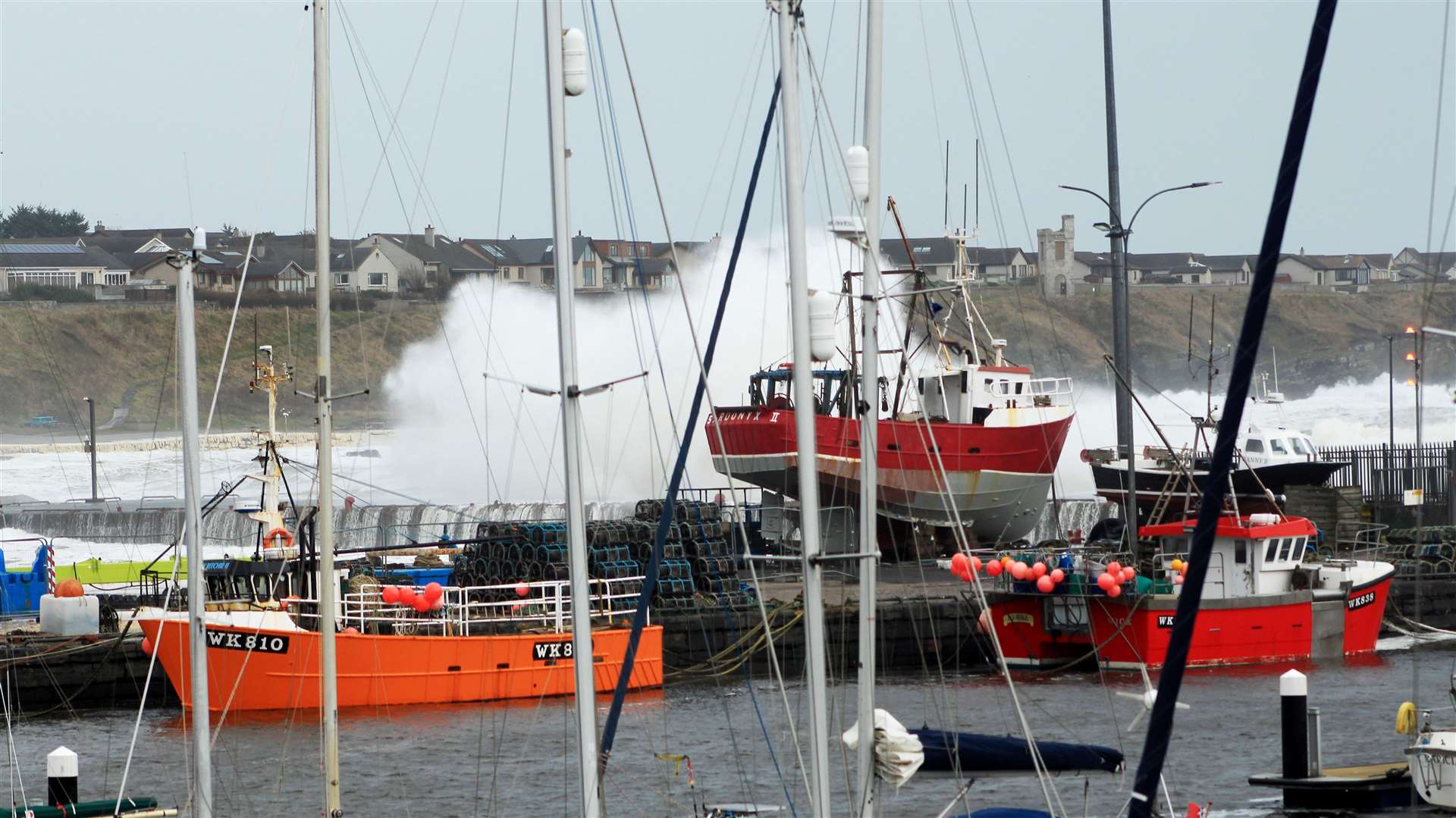 A wave hitting the harbour wall during high tide on Sunday. Picture: Alan Hendry