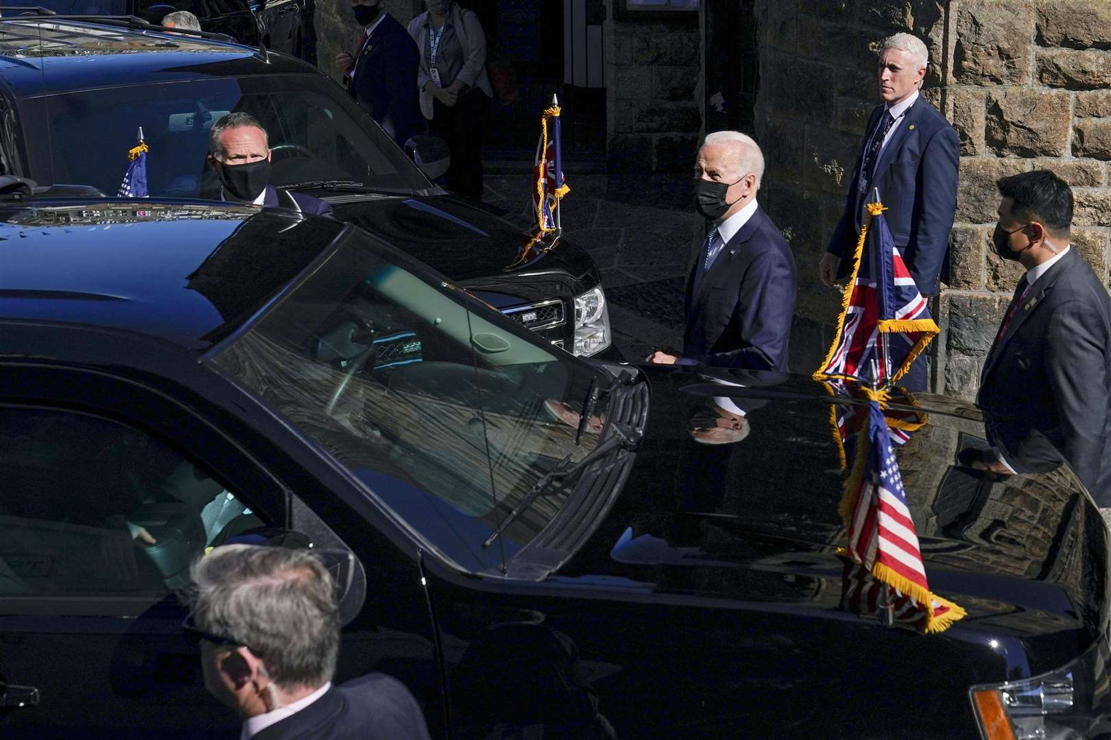 US President Joe Biden, centre, leaves after attending Mass at Sacred Heart and St Ia Catholic Church, in St Ives, Cornwall (Patrick Semansky/AP)