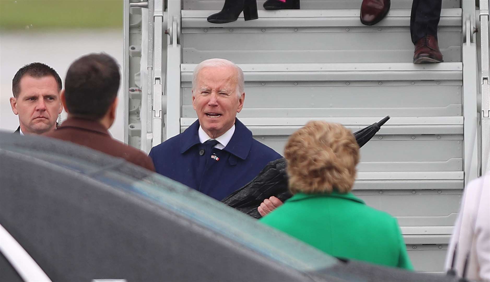 Mr Biden is greeted on arrival in Dublin (Damien Storan/PA)