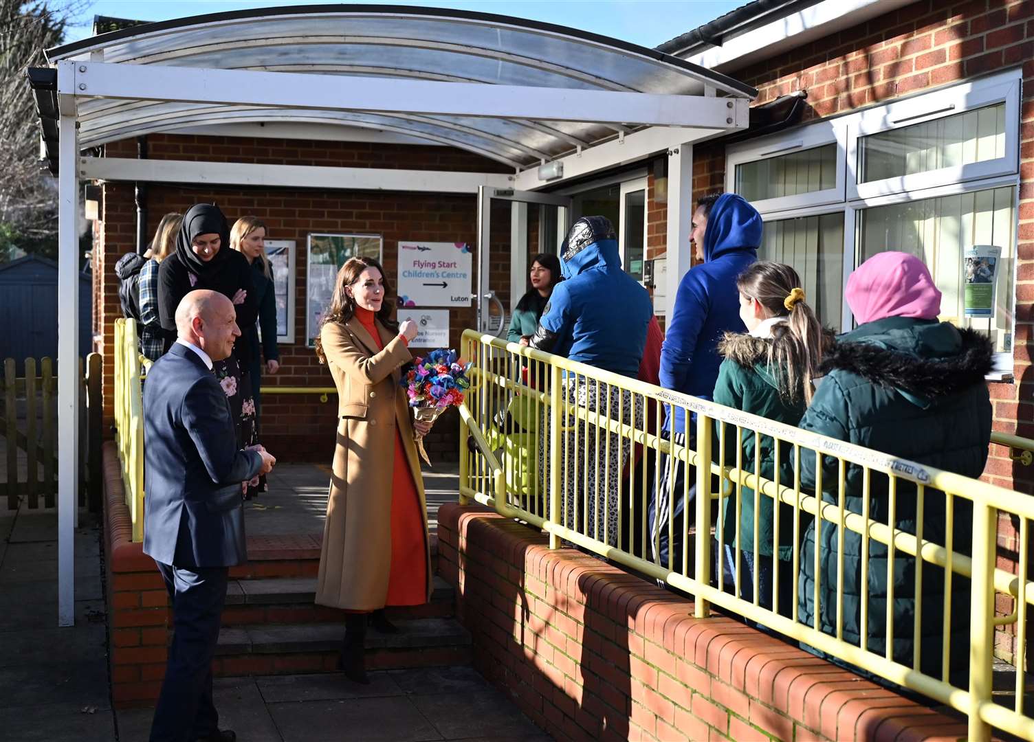 The Princess of Wales talks to parents waiting to collect their children (Justin Tallis/PA)