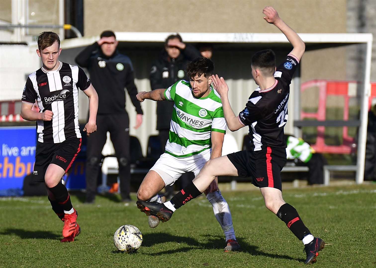Ryan Campbell challenges Sam Urquhart during Wick's defeat to Buckie at Harmsworth Park in March. Picture: Mel Roger