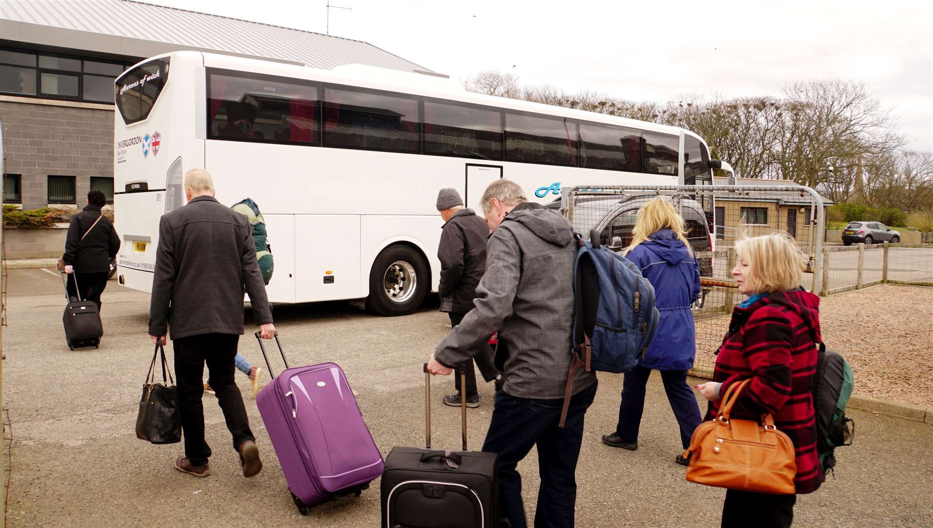 The passengers are allocated a bus to take them on their journey south from Wick.