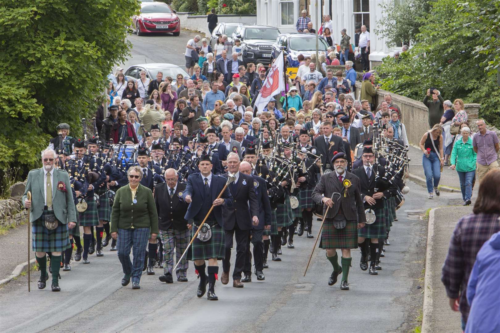 The 2022 Halkirk Highland Games – the first since 2019 – got under way with the traditional march from the centre of the village to the games field, led by Thurso and District Pipe Band and Wick RBLS Pipe Band along with games chieftain Viscount Thurso (front, right) and Halkirk Highland Games Association president Alistair Swanson (front, left). Picture: Robert MacDonald / Northern Studios