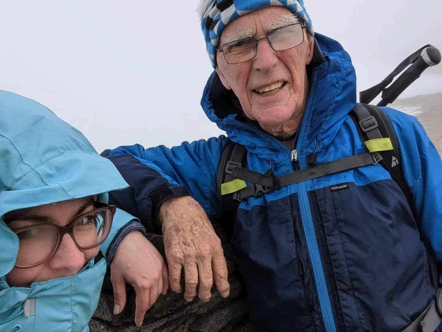 Fred Ward and Kathryn Mulville pictured at the 3,120 feet summit of Helvellyn (Kathryn Mulville/PA)