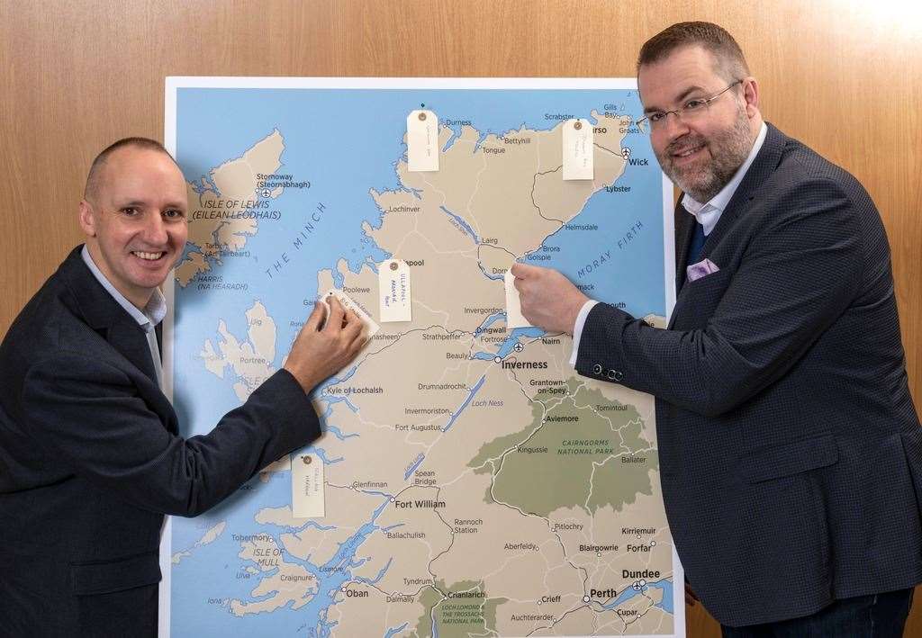 Chris Taylor (left), VisitScotland regional leadership director, and Jóhannes Þór Skúlason, of the Icelandic Travel Industry Association, with a map of the Highlands onto which delegates were encouraged to share and pin their hidden gems.