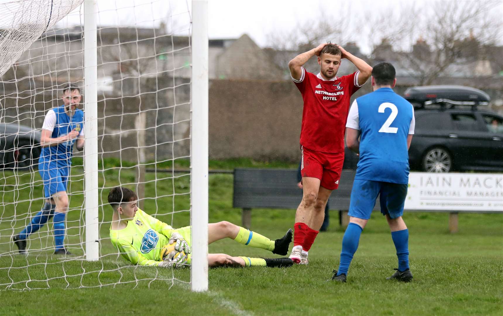 Wick Groats' Jonah Martens holds his head after Kenzie Cannop saved his header on the line. Picture: James Gunn