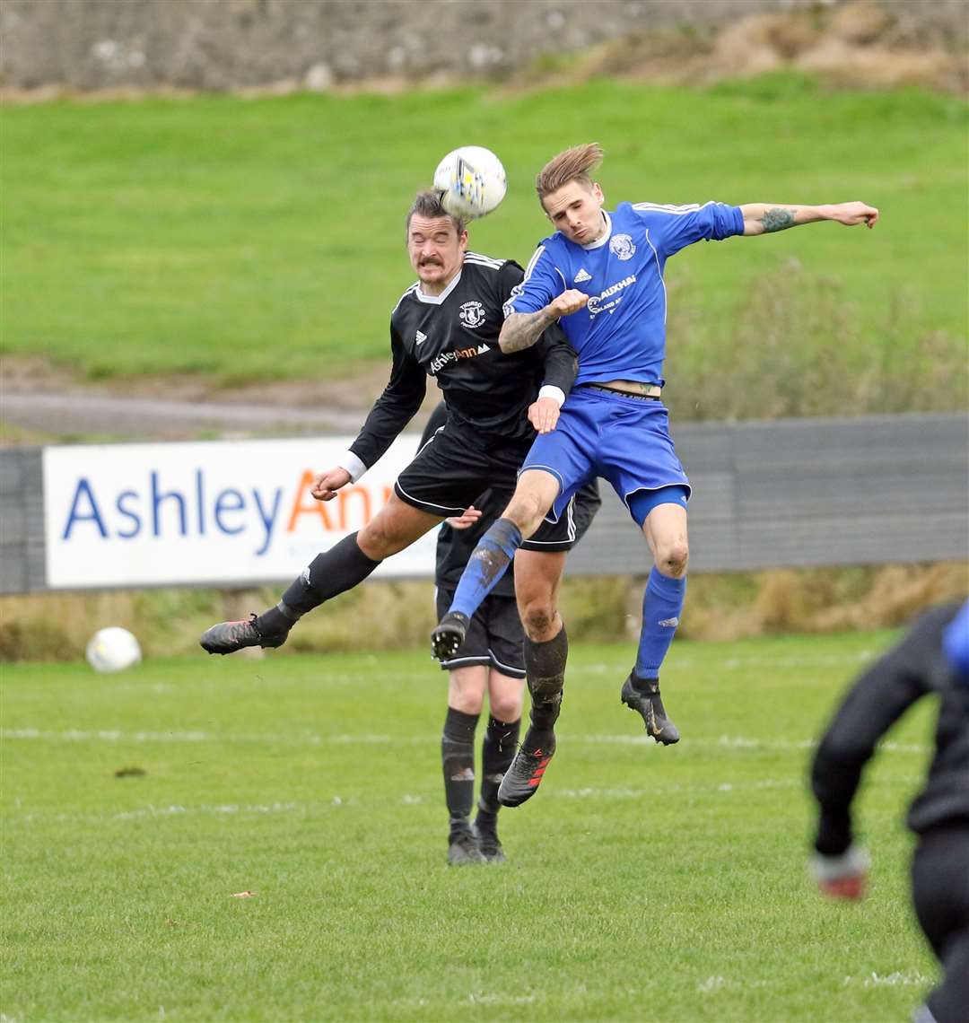 Thurso's James McLean in an aerial battle with Liam Bremner of Golspie when the teams met at the Dammies on the opening day of the North Caledonian League season last month. Picture: James Gunn