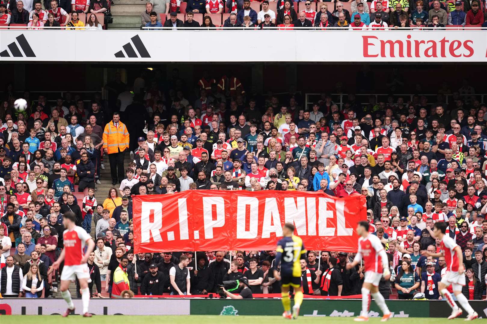Arsenal fans hold up a banner in memory of Daniel (Adam Davy/PA)