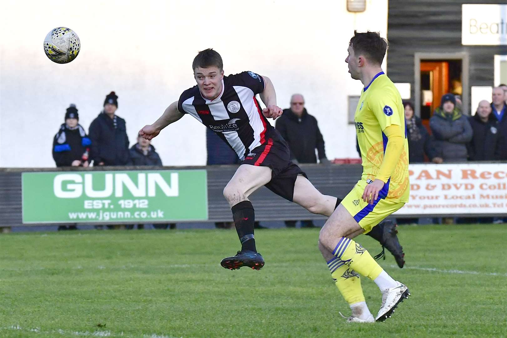 Wick Academy's Jamie Flett directs a header towards goal against Buckie Thistle. Picture: Mel Roger