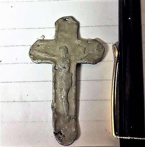 One side of the small cross found at Murkle beach shows Jesus crucified. Pictures: Mike Ross