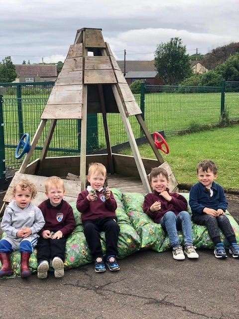 Youngsters enjoying the outdoor area at the nursery.