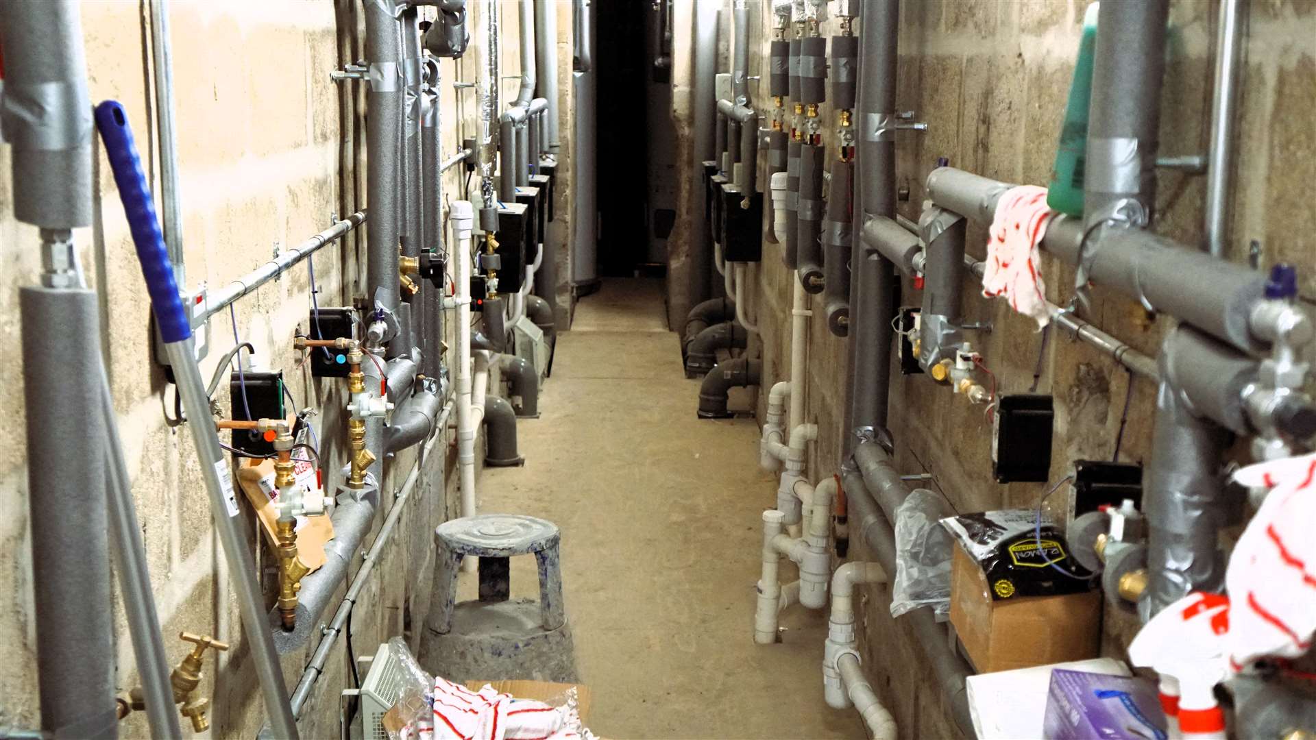 Behind a locked door is a myriad of pipes for the toilet plumbing and showers. Picture: DGS