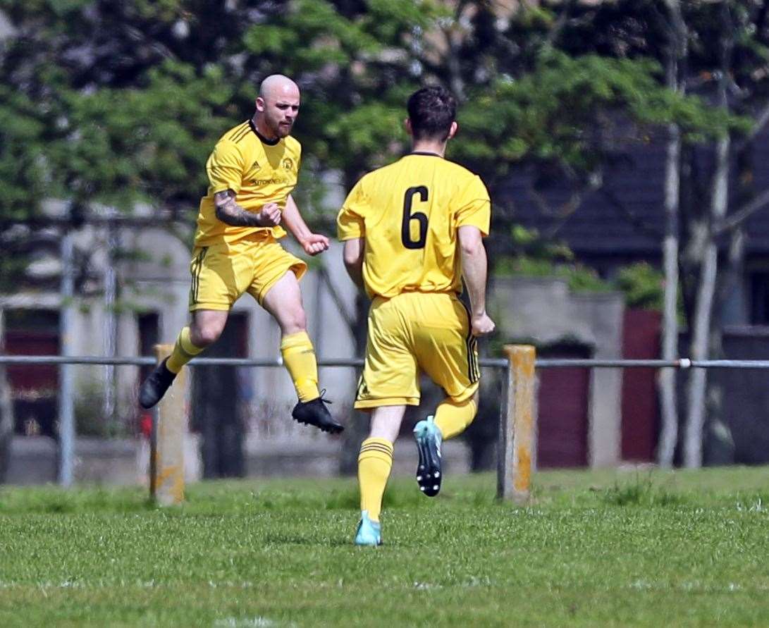 Staxigoe's Martin Banks jumps for joy after scoring the opening goal in their 4-3 Highland Amateur Cup win against Kirkwall Thorfinn. Team-mate Marc Coghill runs over to join in the celebration. Picture: James Gunn