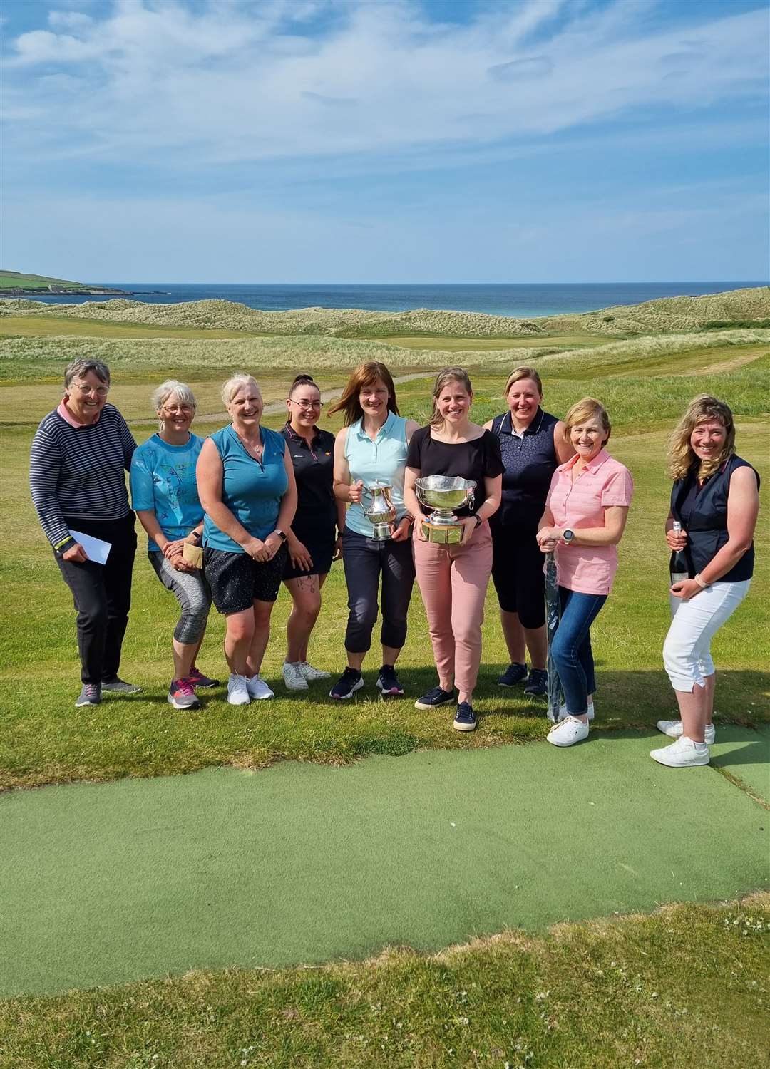 Prizewinners from the Reay Ladies' Open sponsored by Bighouse Melvich, including handicap winner Heather Campbell and scratch winner Rebecca Munro with their trophies.