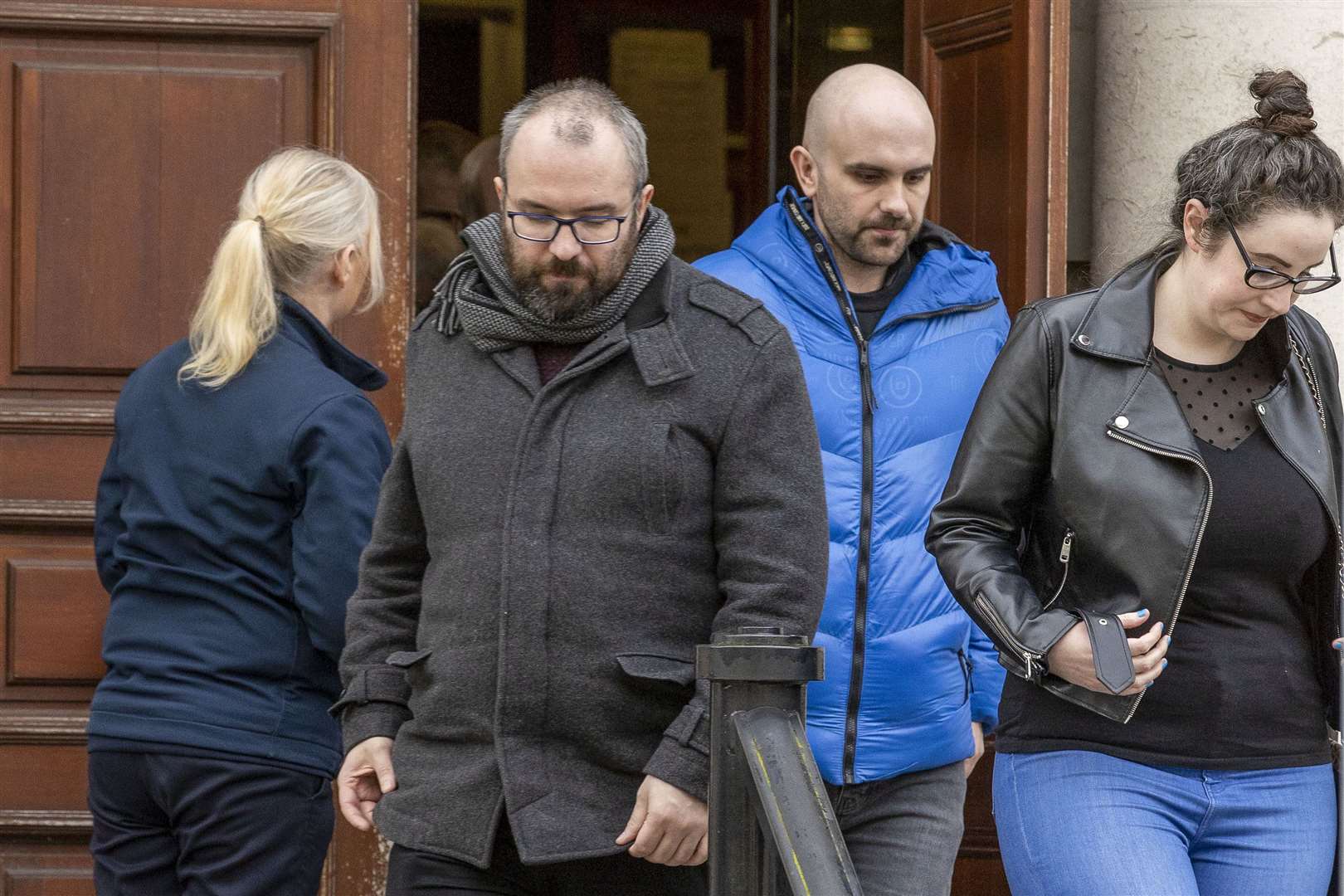 Natalie McNally’s brother’s Brendan (centre left) and Declan (centre right) with friends, family members and supporters leaving Belfast High Court (Liam McBurney/PA)
