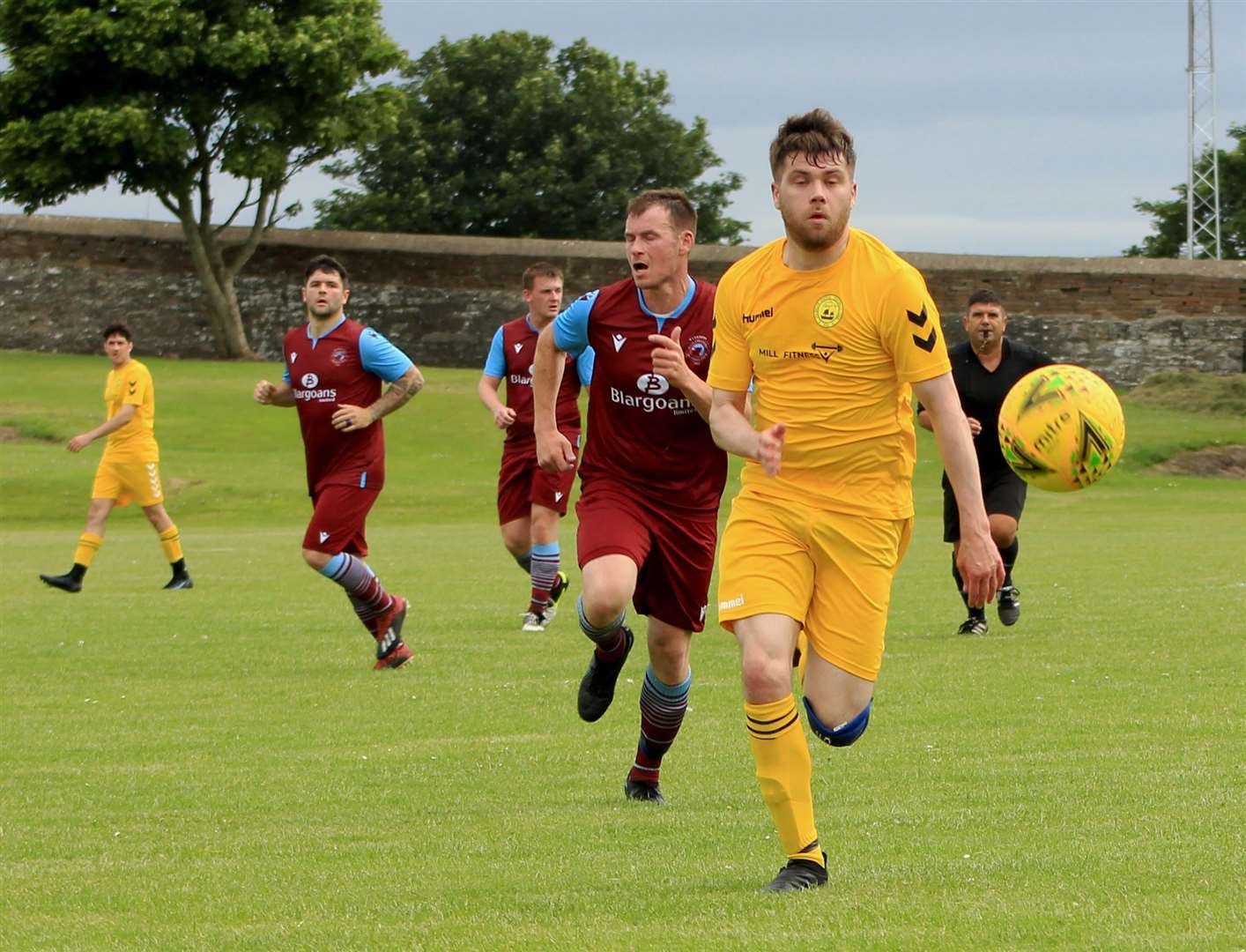 Chrissy Green gets to the ball ahead of Pentland United's Allan Munro.