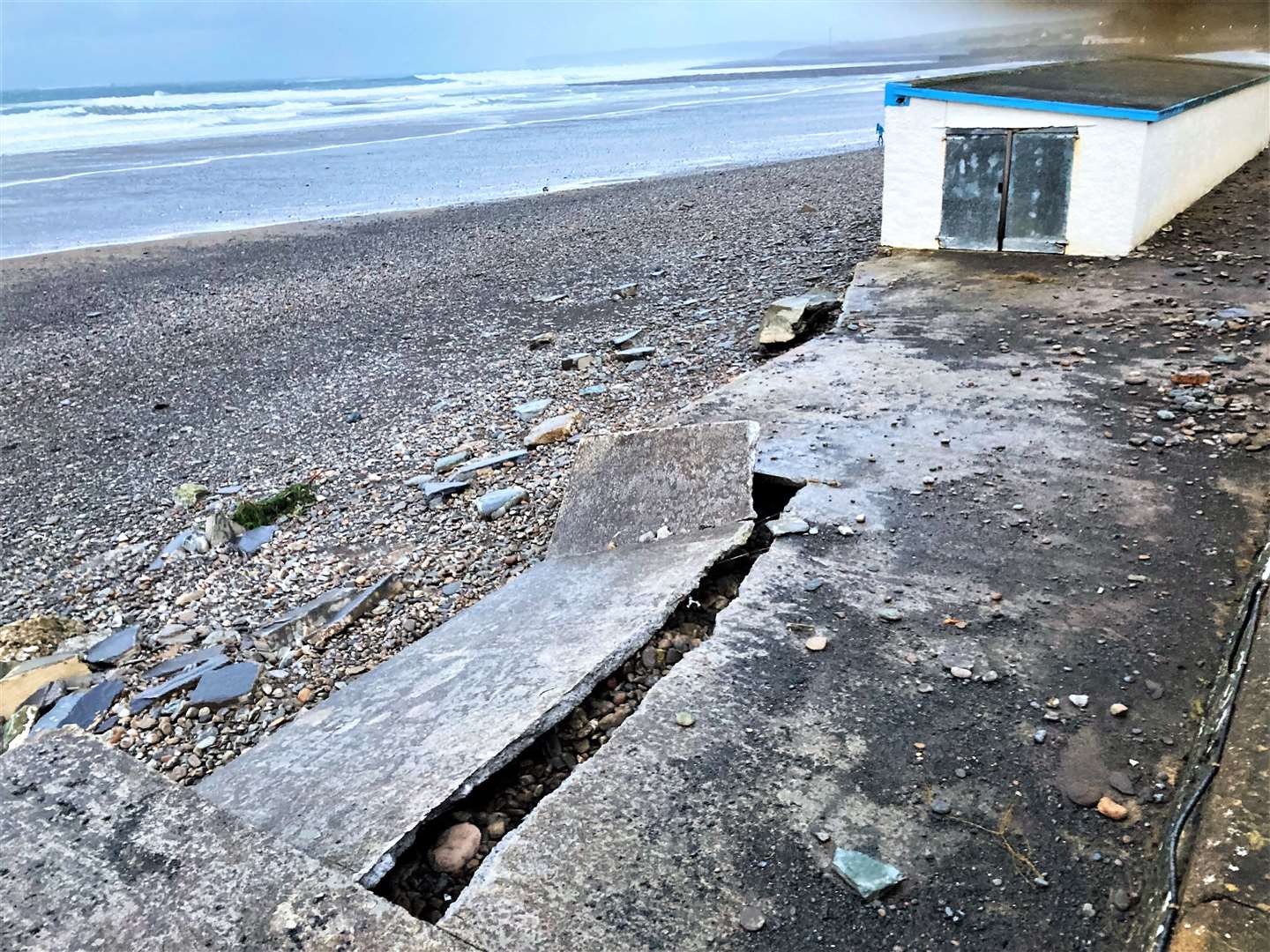 A large section of the Esplanade has cracked off and fallen to the beach. Picture: Matthew Reiss