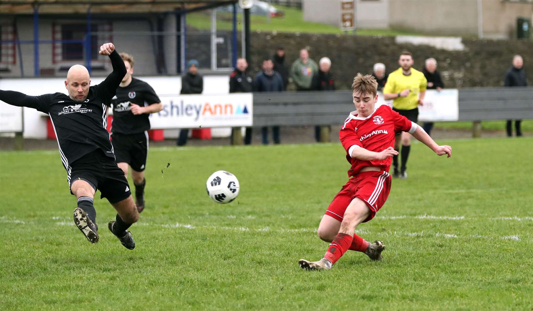 Thurso's Cameron Montgomery fires a shot which John Skinner of St Duthus tries to block. Picture: James Gunn