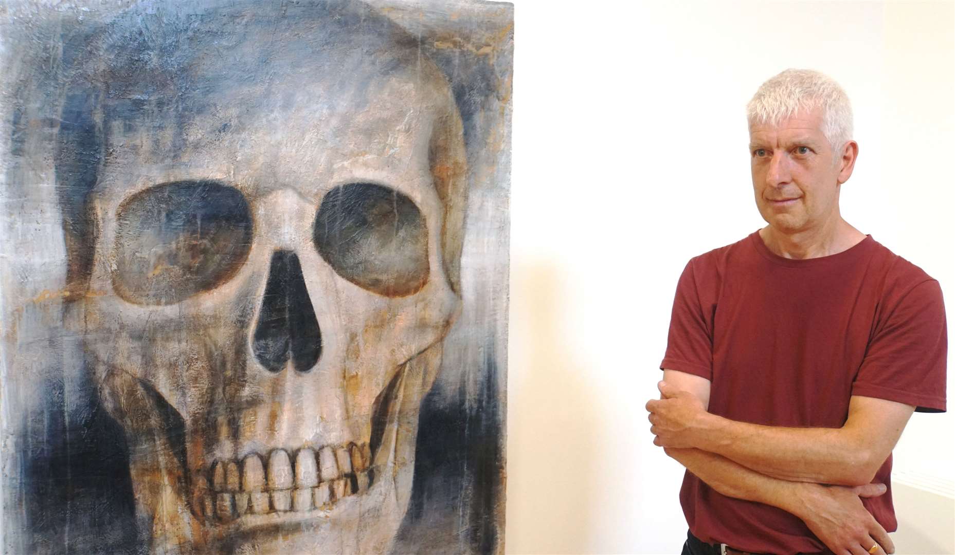 Peter White with one of his works called Scull 2.