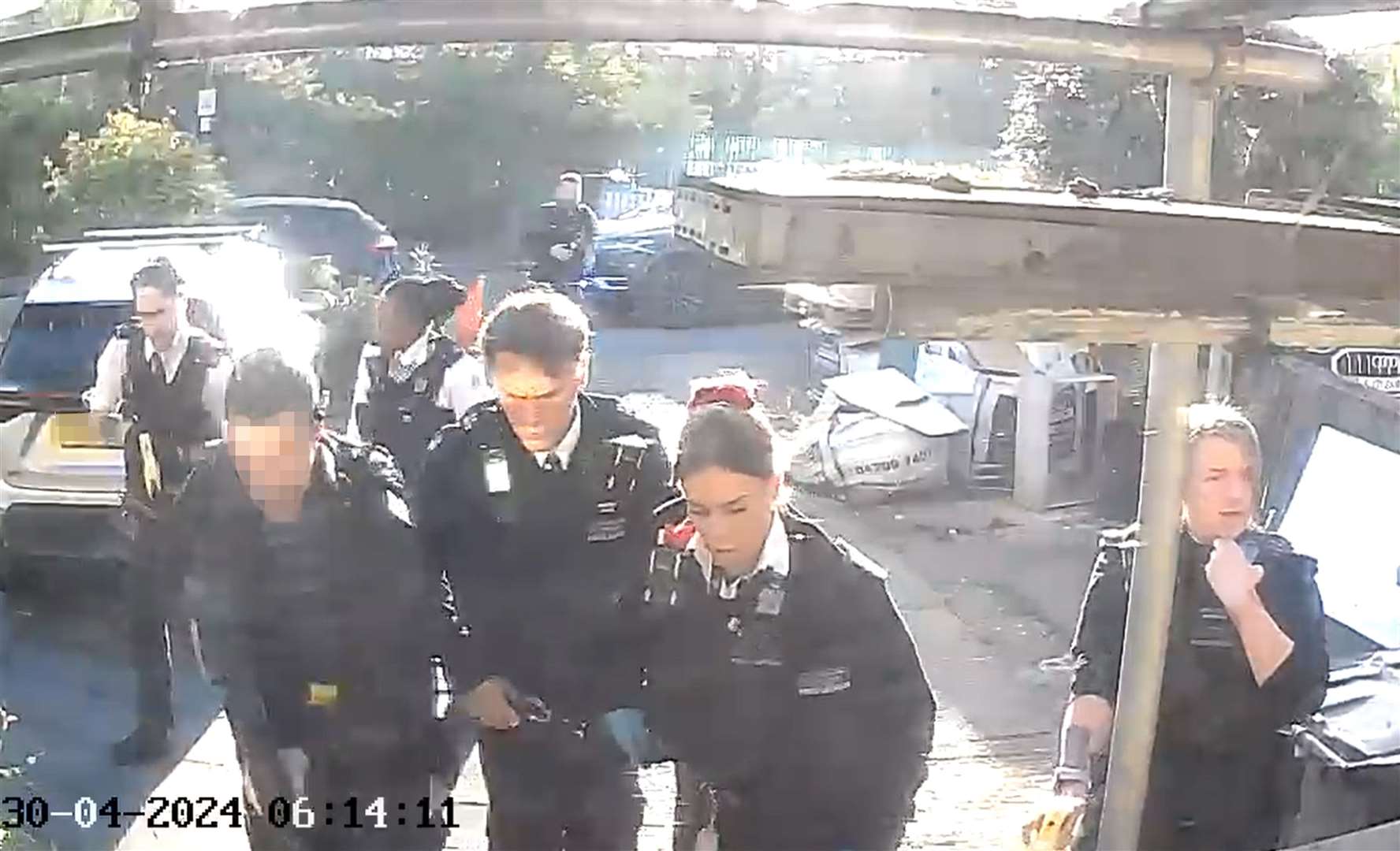 Police officers after tasering and detaining a man (PA)