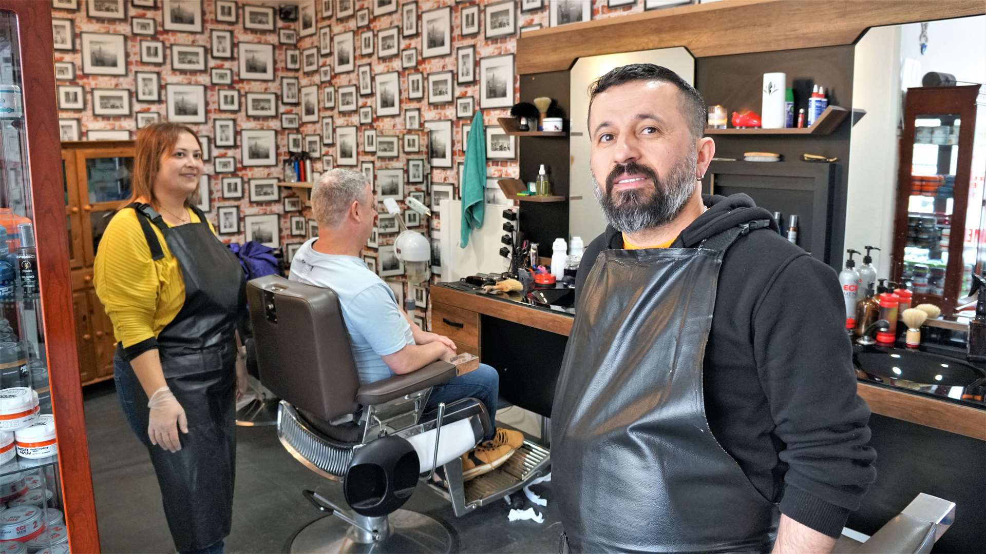 Ismail Dogrulmaz with his wife Derya at their barber shop in Thurso. Picture: DGS