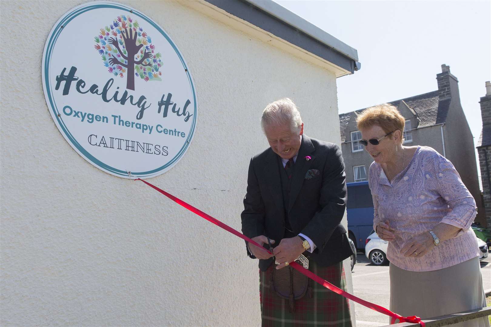 The Duke of Rothesay sees the humorous side as he attempts to cut the ribbon at the Healing Hub and finds that the scissors may not be quite sharp enough. Picture: Robert MacDonald / Northern Studios