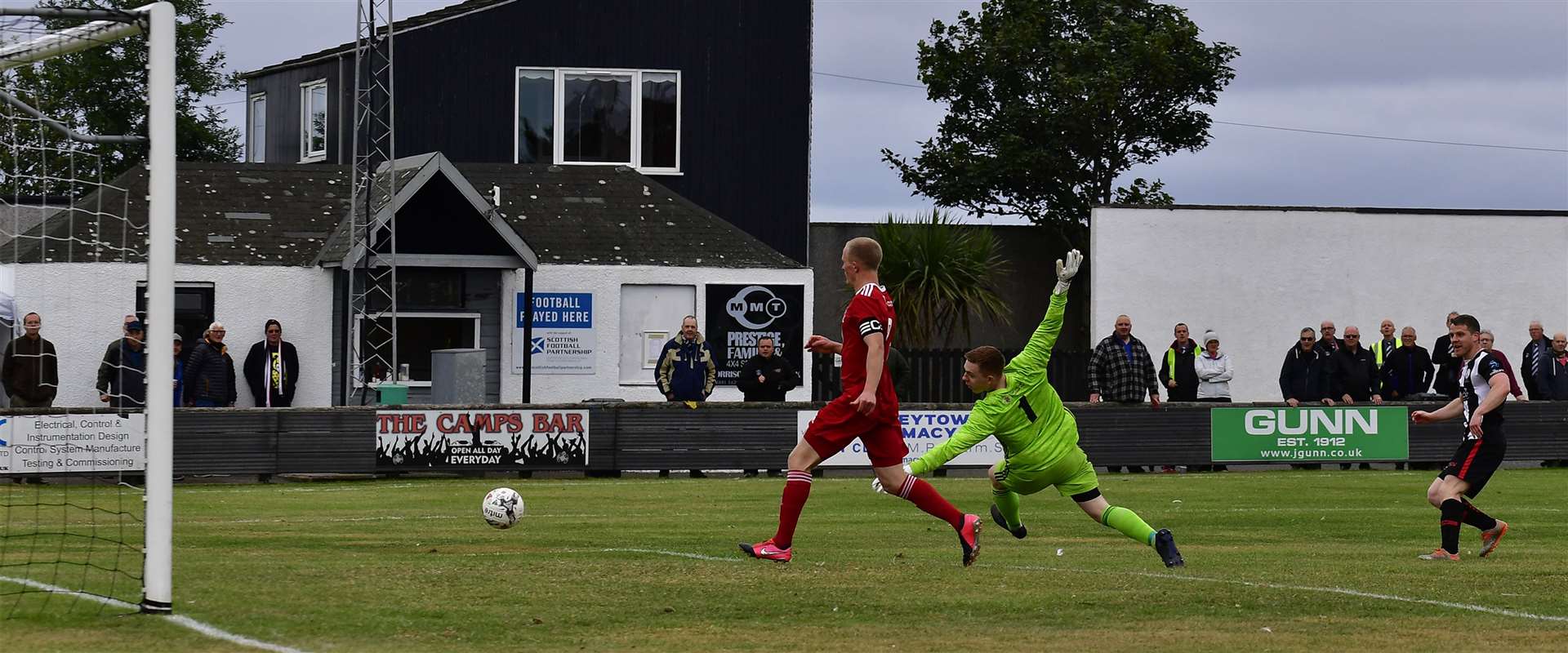 Davie Allan watches his shot beat Deveronvale keeper Sean McIntosh to open the scoring for Wick Academy in Saturday's 2-2 draw. Picture: Mel Roger