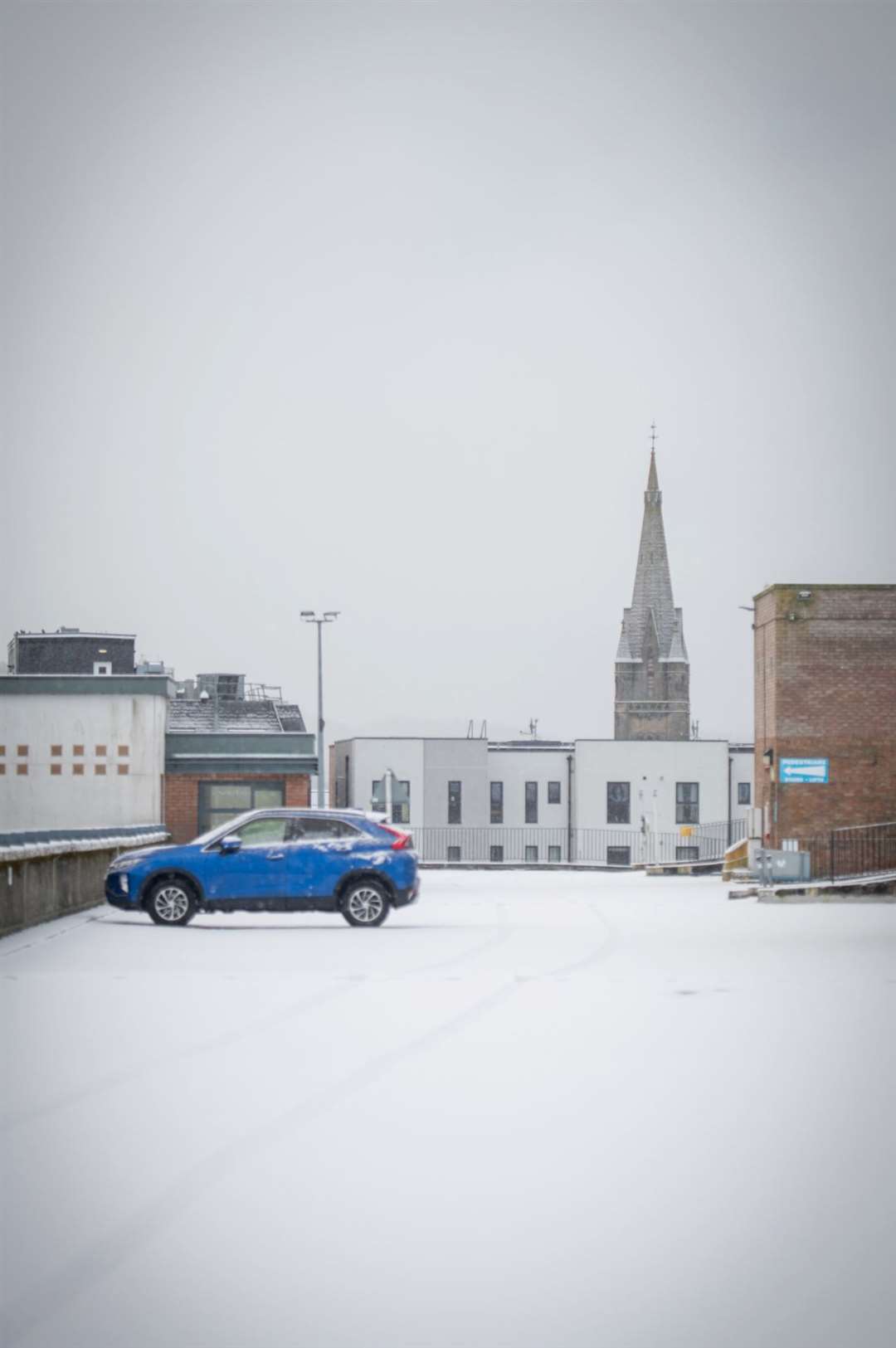 A solitary car parked on the top storey at the Rose Street car park in Inverness.