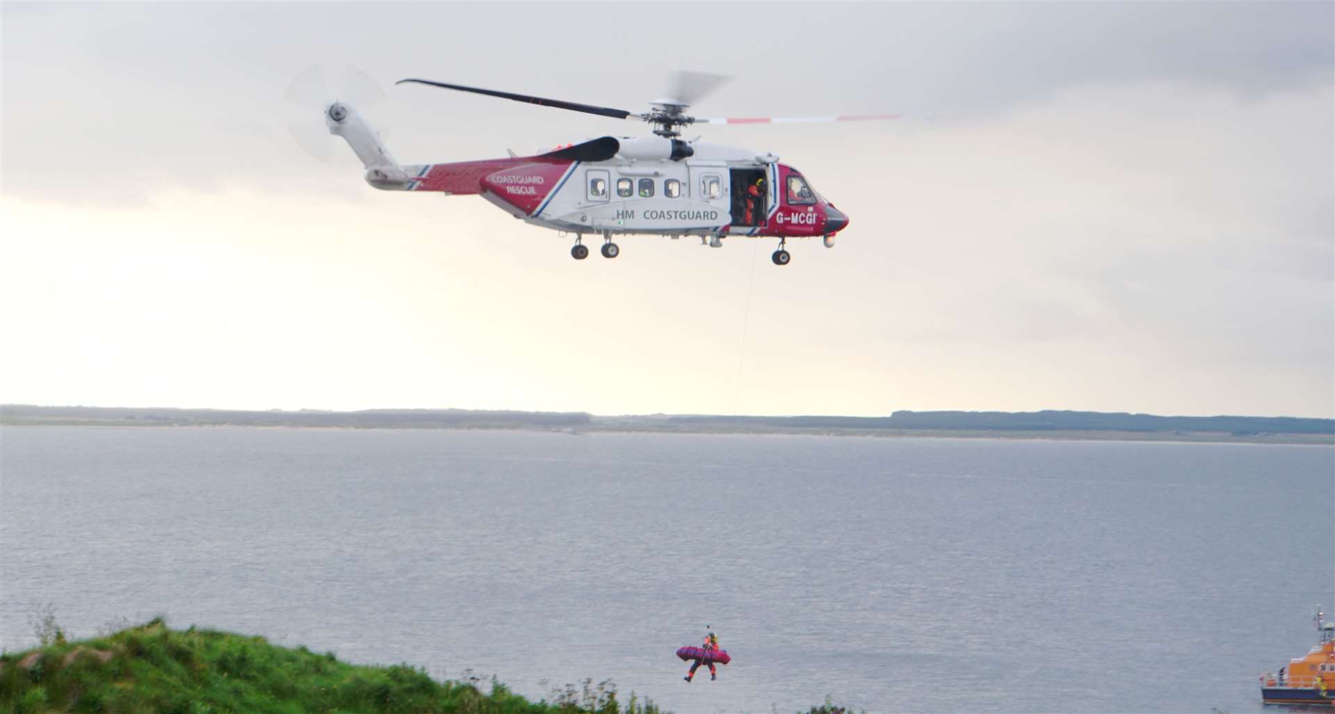 The injured boy is winched on board the coastguard helicopter.
