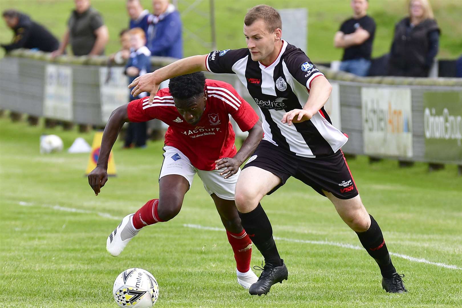 Owen Rendall of Wick Academy takes on Deveronvale's Horace Ormsby. Picture: Mel Roger