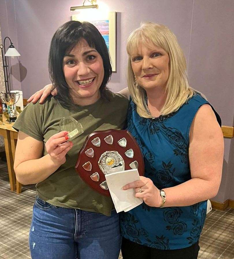 Competition organiser Pauline Craig (right) presents the Marina Swanson Memorial Shield for character and grit to Dunfermline-based Caithness exile Kirsty Grant.