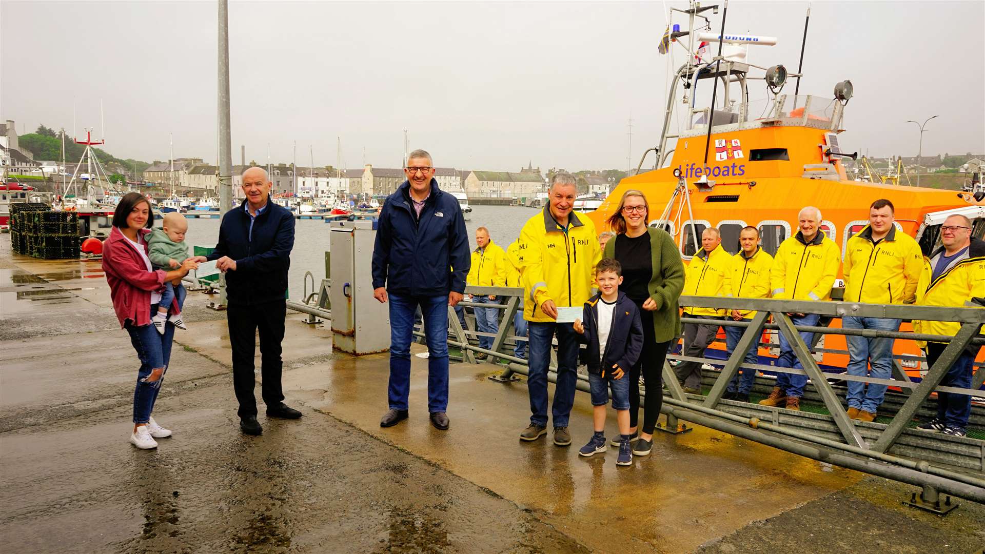 From left: Lauren McWilliam with Harry, Andrew Bremner and Willie Watt of the Seafarers Memorial Group, Ian Cormack of Wick RNLI and Lynne Davidson with Joe. Picture: Matthew Thain