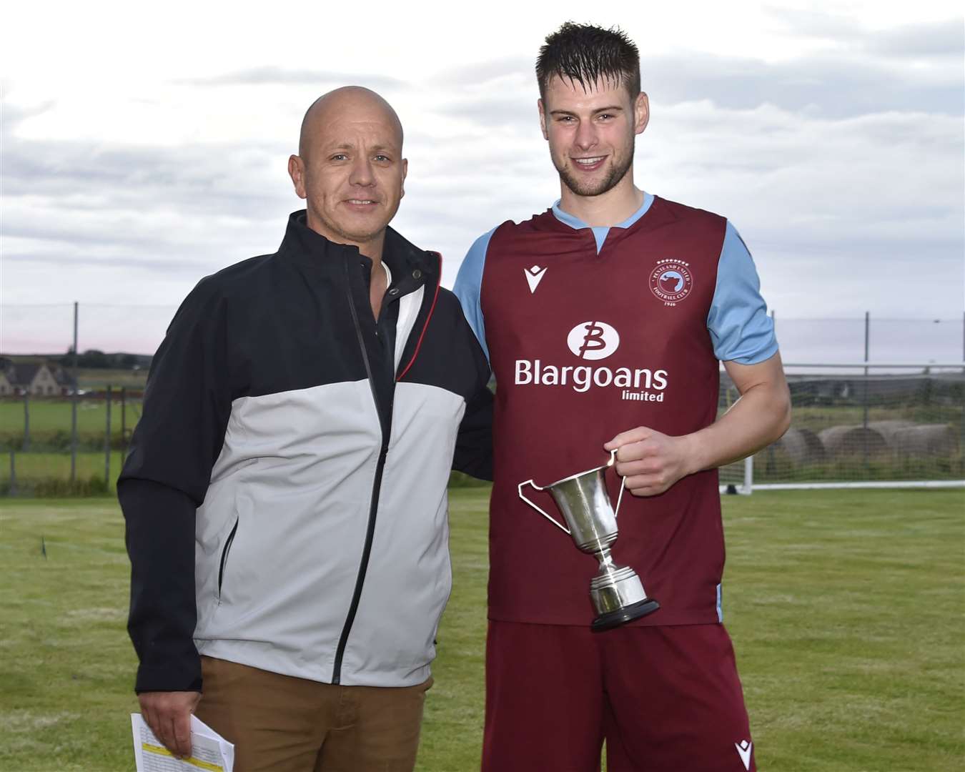 CAFA secretary Andrew Lannon presents the player of the season award to Pentland United's Marc Macgregor. The striker scored a first-half hat-trick as the Stabbies beat Wick Thistle 6-1 to secure the county league title for the first time since 2011. Picture: Mel Roger