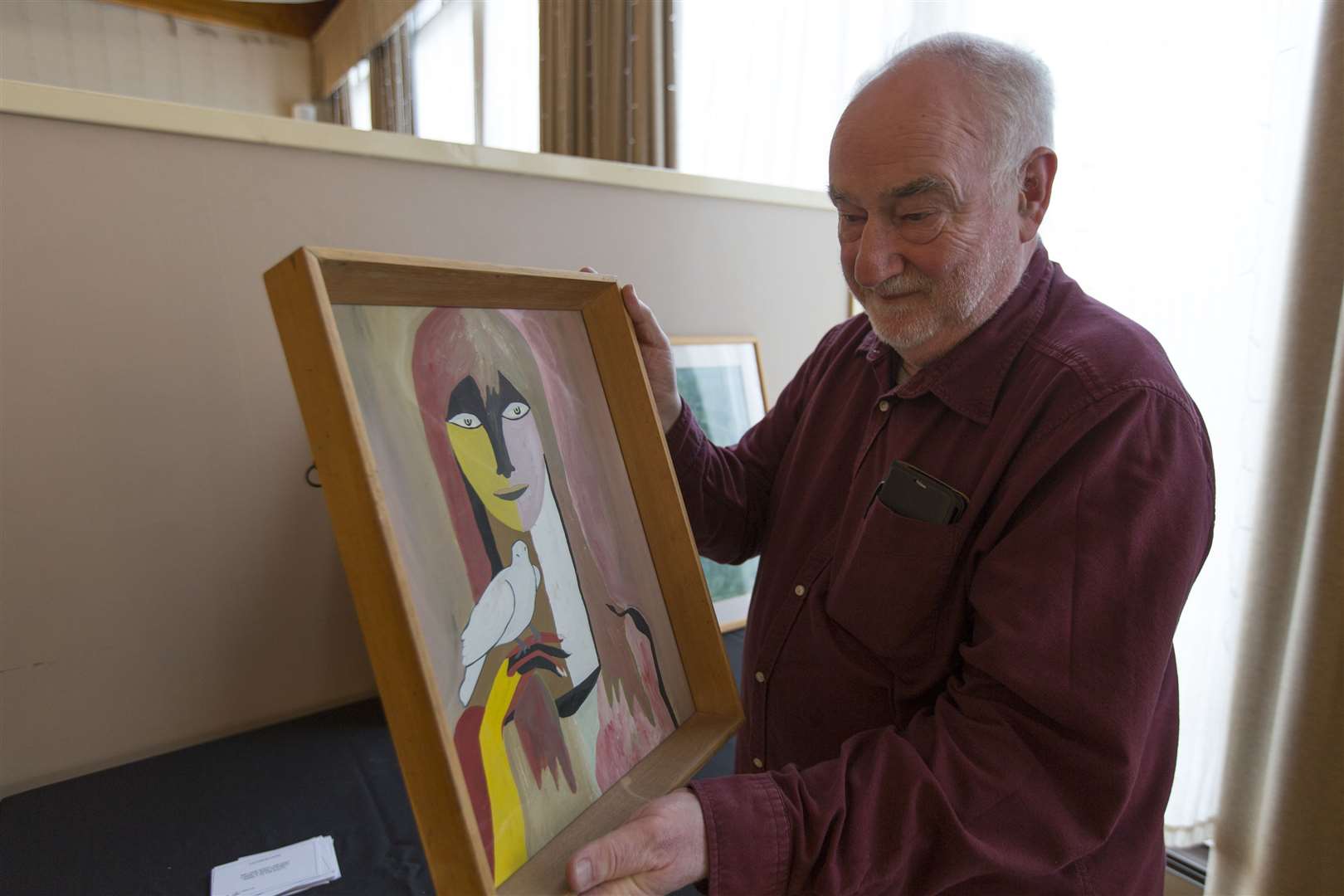 Drew Macleod, who organised Saturday afternoon's gathering to remember David Morrison, with one of the paintings that were on display in a small exhibition of his work in Mackays Hotel. Picture: Robert MacDonald / Northern Studios